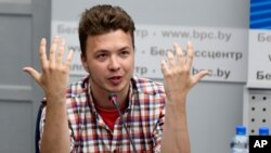 Belarusian dissident journalist Raman Pratasevich gestures while speaking at a news conference at the National Press Center of Ministry of Foreign Affairs in Minsk, Belarus, June 14, 2021. 