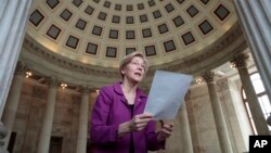 Holding a transcript of her speech in the Senate Chamber, Sen. Elizabeth Warren reacts to being rebuked by the Senate leadership and accused of impugning a fellow senator, Attorney General-designate, Sen. Jeff Sessions, Feb. 8, 2017.
