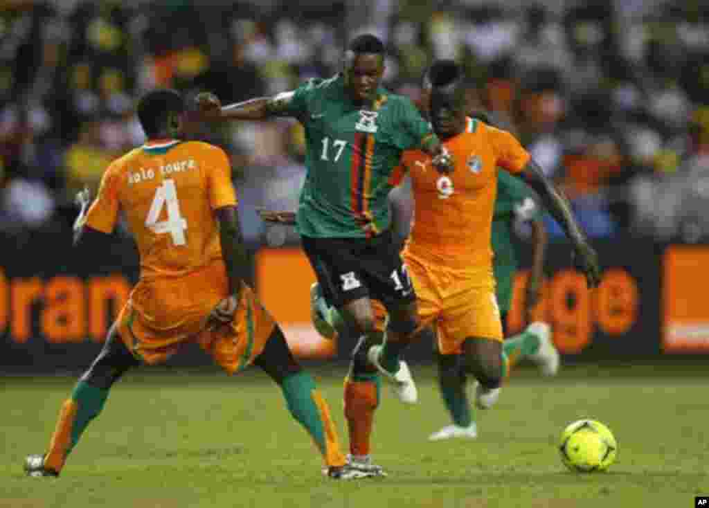 Zambia's Rainford Kalaba (L) challenges Kolo Toure (L) and Collins Mbesuma of Ivory Coast during their African Nations Cup final soccer match at the Stade De L'Amitie Stadium in Gabon's capital Libreville February 12, 2012.