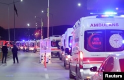 Ambulances line up at the entrance of the headquarters of Turkish aerospace and defense company TUSAS near Ankara, where five people were killed in an attack, Oct. 23, 2024.