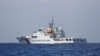 FILE - A China Coast Guard vessel patrols the disputed Scarborough Shoal, April 6, 2017.