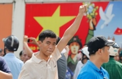 FILE - A protester gestures as he marches during an anti-China protest in Vietnam's southern Ho Chi Minh City, May 18, 2014.