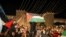 Palestinians celebrate outside Damascus Gate after barriers that were put up by Israeli police are removed, allowing them to access the main square that has been the focus of a week of clashes around Jerusalem's Old City, April 25, 2021.