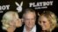 FILE - Playboy magazine founder Hugh Hefner arrives with girlfriend Kendra Wilkinson, left, and Bridget Marquardt for his 80th birthday party in Munich's famous club P1, May 31, 2006. 
