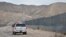 A U.S. Border Patrol agent drives near the U.S.-Mexico border fence in Sunland Park, New Mexico, Jan. 4, 2016. 