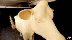 FILE - The Butter Cow is displayed at the 2017 Iowa State Fair in Des Moines, Iowa. 