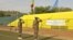 Peacekeepers of the United Nations Multidimensional Integrated Stabilization Mission in Mali (MINUSMA) salute Mali and UN flags on May 29, 2015, in Bamako.