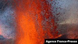 This aerial photograph shows the erupting Piton de la Fournaise volcano on the French Indian Ocean island of Reunion.