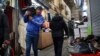 FILE - People conduct their business at the Grand Bazaar in Tehran, Iran, Feb. 7, 2019.