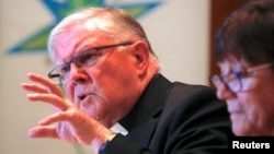 Archbishop Mark Coleridge, president of the Australian Catholic Bishops Conference, speaks as Sister Monica Cavanagh, president of Catholic Religious Australia, listens during a news conference in Sydney, Australia, Aug. 31, 2018. 