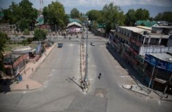 A deserted street is seen during curfew in Srinagar, Indian-controlled Kashmir, Aug. 4, 2020.