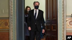 Antony Blinken, accompanied by his wife Evan Ryan, arrives for his ceremonial swearing-in as Secretary of State, Wednesday Jan. 27, 2021, in Vice President Kamala Harris' ceremonial office, in the Eisenhower Executive Office Building, on the White…