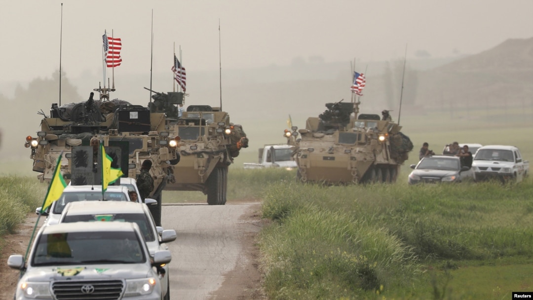 YPG Fighters and US military vehicles