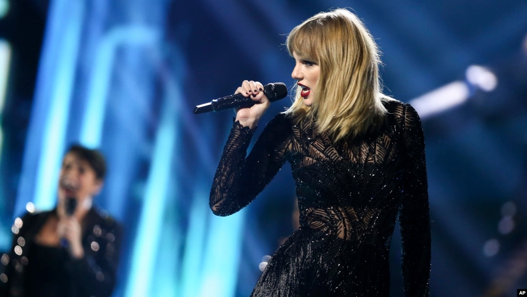 FILE - Taylor Swift performs at DIRECTV NOW Super Saturday Night Concert at Club Nomadic in Houston, Texas. 