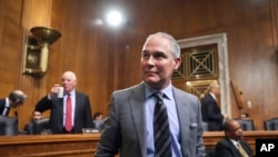 FILE - Environmental Protection Agency Administrator Scott Pruitt arrives to testify before the Senate Environment Committee on Capitol Hill in Washington, Jan. 30, 2018.