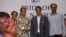 India’s P.V. Sindhu, second left, who won one of India's two medals at the Rio de Janeiro Olympics poses with her coach Pullela Gopichand, second right, mother, P. Vijaya, left, and father, P.V. Ramana, right, during their reception at the Gopichand Acade