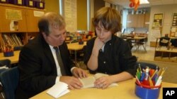 Mentor Tony Boccia and mentee Baily Raffensperger go over a reading assignment.