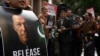 FILE - A supporter of jailed former prime minister Imran Khan holds a placard during a protest rally in Sydney on Aug. 4, 2024, demanding Khan's release from jail.