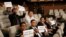 FILE - Yemeni journalists hold placards to support their colleagues jailed in Shi'ite Houthi rebel prisons in Yemen, during a press conference of the United Nations Special Envoy to Yemen in Kuwait City, May 5, 2016.