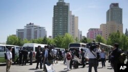 Foreign journalists leave a venue after being told that coverage plans had changed until further notice in Pyongyang, North Korea, May 8, 2016.