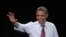 President Barack Obama waves to supporters at a campaign event at Rollins College, in Winter Park, Florida, August 2, 2012.