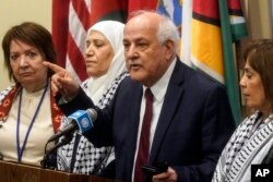 FILE—Palestinian Ambassador to the United Nations Riyad Mansour, second from right, at a press briefing before a meeting of the U.N. Security Council, March 11, 2024, at U.N. headquarters.