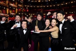 Bong Joon Ho and the cast of "Parasite" pose at the 92nd Academy Awards in Hollywood, Los Angeles, California, U.S., February 9, 2020.