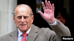 Britain's Prince Philip waves to members of the media as he leaves the King Edward VII Hospital in London June 9, 2012. (File)