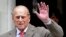 FILE - Britain's Prince Philip waves to members of the media as he leaves the King Edward VII Hospital in London, June 9, 2012.