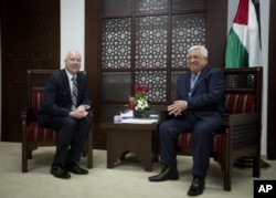 U.S. President Trump's peace process envoy Jason Greenblatt, left, meets with Palestinian President Mahmoud Abbas at the President's office in the West Bank city of Ramallah, March 14, 2017.