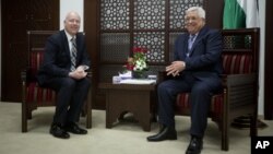 U.S. President Trump's peace process envoy Jason Greenblatt, left, meets with Palestinian President Mahmoud Abbas at the President's office in the West Bank city of Ramallah, March 14, 2017. 