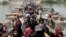 Displaced Sunni people fleeing Ramadi cross a bridge outside Baghdad, May 24, 2015. Iraqi forces recaptured territory from advancing Islamic State militants near the recently fallen city of Ramadi on Sunday.