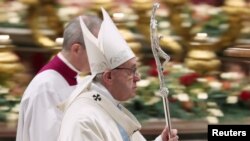 Pope Francis leaves after leading a mass to mark the World Day of Peace in Saint Peter's Basilica at the Vatican, Jan. 1, 2019. 