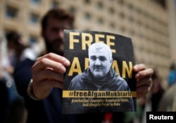 A man attends a rally to support Azerbaijani journalist Efqan Mukhtarli, who was abducted in Tbilisi on May 29 and now is in detention in Baku, in Tbilisi, Georgia, May 31, 2017.