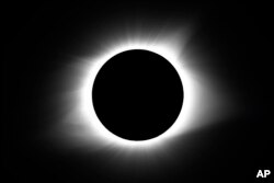 FILE—The moon covers the sun during a total solar eclipse August 21, 2017, in Cerulean, Kentucky.