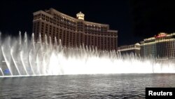 FILE -- Night view of the dancing fountains show at the Bellagio hotel in Las Vegas, Nevada.