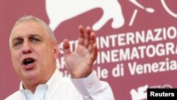 Director Errol Morris gestures during photocall for "The Unknown Known," 70th Venice Film Festival, Venice, Sept. 4, 2013.