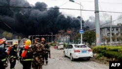 Firefighters and Chinese paramilitary police officers search an explosion site in Yancheng in China's eastern Jiangsu province, March 21, 2019. A huge explosion rocked a chemical plant in eastern China on March 21, killing or injuring dozens as it knocked