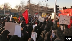 Iranian protesters chant slogans in front of the British embassy in the capital Tehran on January 12, 2020 following the British ambassador's arrest for allegedly attending an illegal demonstration. - Chanting "Death to Britain", up to 200 protesters rallied outside the mission a