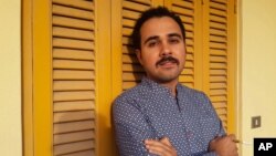 FILE - Egyptian author Ahmed Naji poses for a photo in Cairo, Egypt, in this undated image. Naji was sentenced to two years in jail on Feb. 20, 2016, by a Cairo appeals court for publishing a sexually explicit excerpt of his novel.