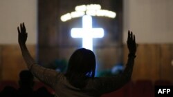 People pray at a morning service for singer Aretha Franklin at the New Bethel Baptist Church on Aug. 15, 2018 in Detroit, Michigan. 