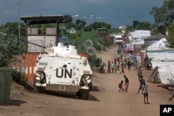 FILE - A United Nations armored personnel carrier stands in a camp for the internally-displaced in Juba, South Sudan, July 25, 2016.