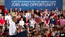 President Barack Obama gestures as he speaks about the economy, jobs, and manufacturing, at North Carolina State University in Raleigh, North Carolina, Jan. 15, 2014.