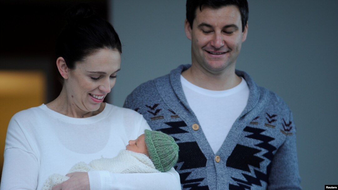 New Zealand Prime Minister Jacinda Ardern carries her newborn baby Neve Te Aroha Ardern Gayford with partner Clarke Gayford as she walks out of the Auckland Hospital in New Zealand, June 24, 2018.