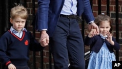 Britain's Prince William arrives with Prince George and Princess Charlotte back to the Lindo wing at St Mary's Hospital in London London, Monday, April 23, 2018. The Duchess of Cambridge gave birth Monday to a healthy baby boy — a third child for Kate and