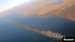 The island village of Kivalina, which the White House chose to highlight as a community at risk from rising sea levels, can be seen from Air Force One as U.S. President Barack Obama flies to Kotzebue, Alaska, Sept. 2, 2015.