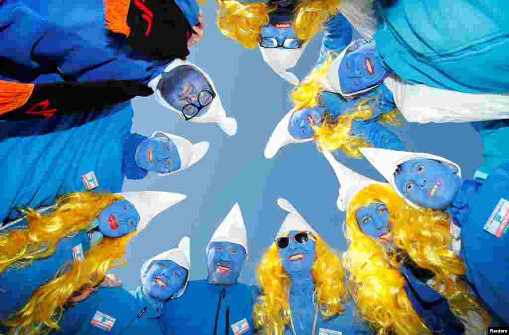 Participants dressed as smurfs pose during an attempt to hold the world&#39;s largest meeting of smurfs in Lauchringen, Germany, Feb. 16, 2019.