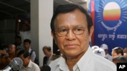 FILE - Opposition party Cambodia National Rescue Party (CNRP) President Kem Sokha adressess party supporters during the party's political congress in Phnom Penh, Cambodia, March 2, 2017.