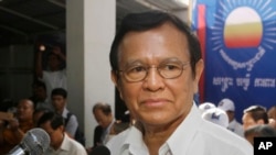 FILE - Opposition party Cambodia National Rescue Party (CNRP) President Kem Sokha adressess party supporters during the party's political congress in Phnom Penh, Cambodia, March 2, 2017.