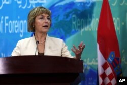 FILE - Croatian Foreign Minister Vesna Pusic speaks during a press conference with her Iraqi counterpart Ibrahim al-Jaafari in Baghdad, Iraq, May 3, 2015.